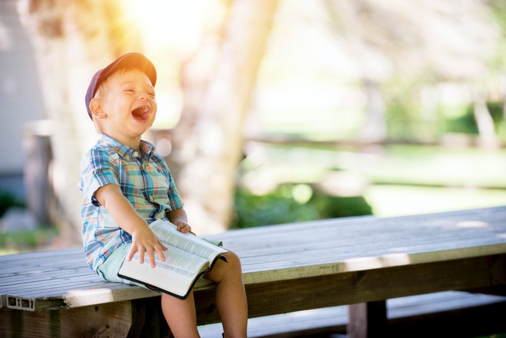 Happy children playing with parents